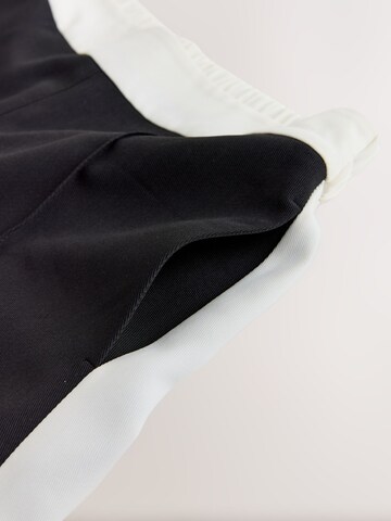 melns Next Platas staras Bikses