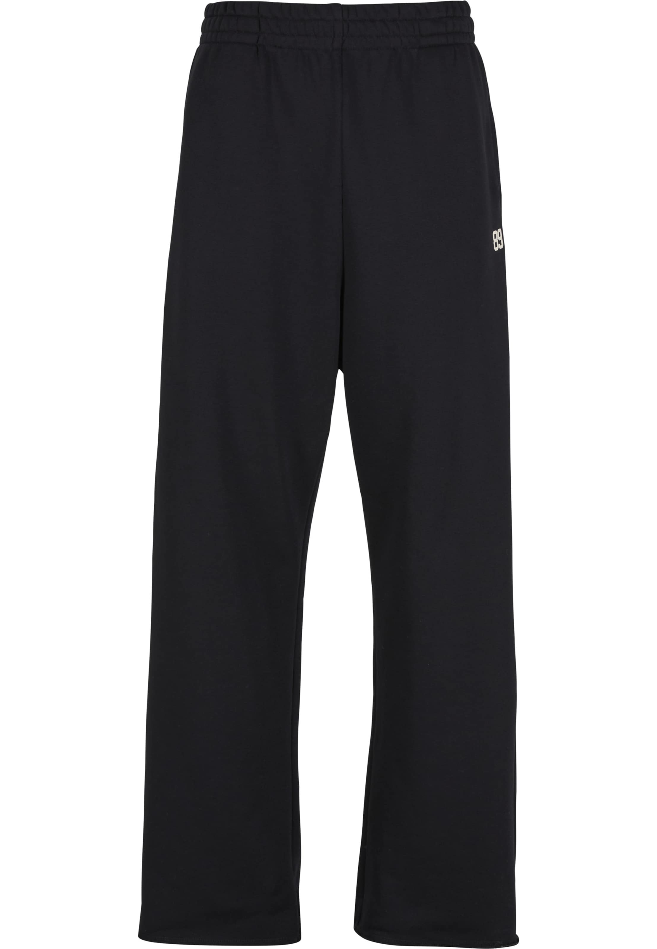 Karl Kani - Loosefit Pantalón '89' en negro: frente