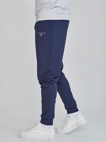 Tapered Pantaloni sportivi di SikSilk in blu