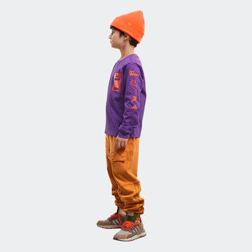 ADIDAS ORIGINALS Tapered Pants 'Ivy Park' in Orange