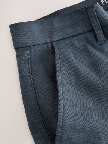Next Slimfit Chinobyxa i blå