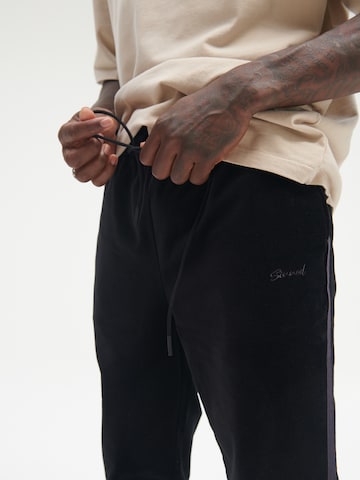 Sinned x ABOUT YOU Regular Pants 'LUCA' in Black