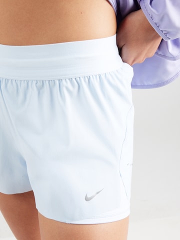 NIKE Štandardný strih Športové nohavice 'Swift' - Modrá