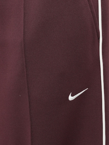 Nike Sportswear Zvonové kalhoty Kalhoty – červená