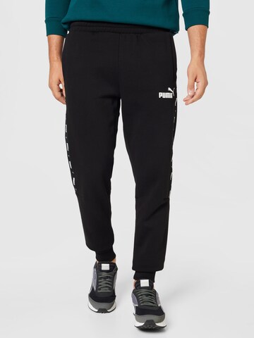 PUMA Tapered Workout Pants 'Ess+' in Black: front