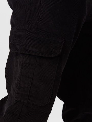 Urban Classics - Tapered Pantalón cargo en negro