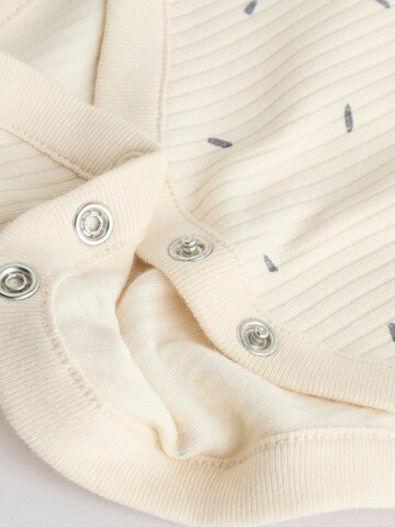 Next Sparkdräkt/body i beige