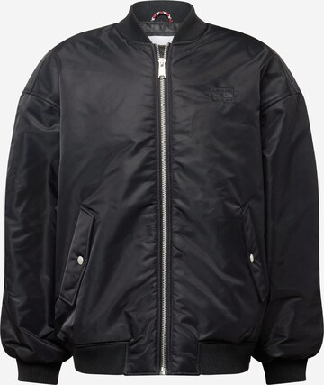 Tommy Jeans Between-season jacket in Black: front