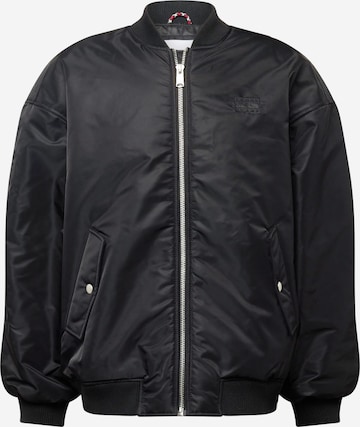 Tommy Jeans Prehodna jakna | črna barva: sprednja stran