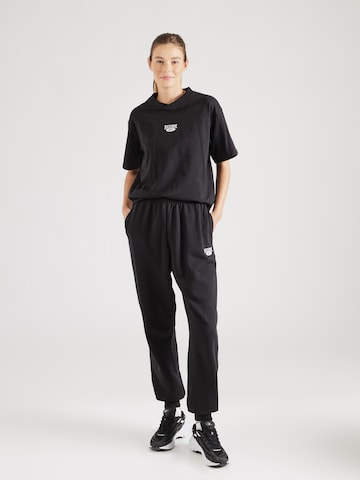 Effilé Pantalon de sport Reebok en noir