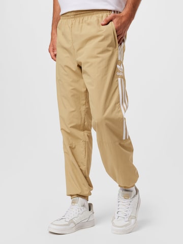 ADIDAS ORIGINALS Tapered Trousers in Beige: front