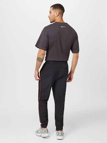 ELLESSE Regular Sporthose in Schwarz