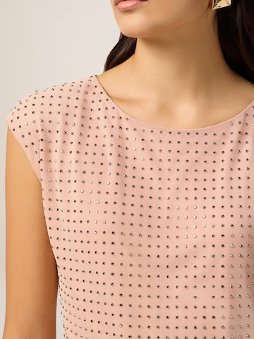 Top di oltre in rosa