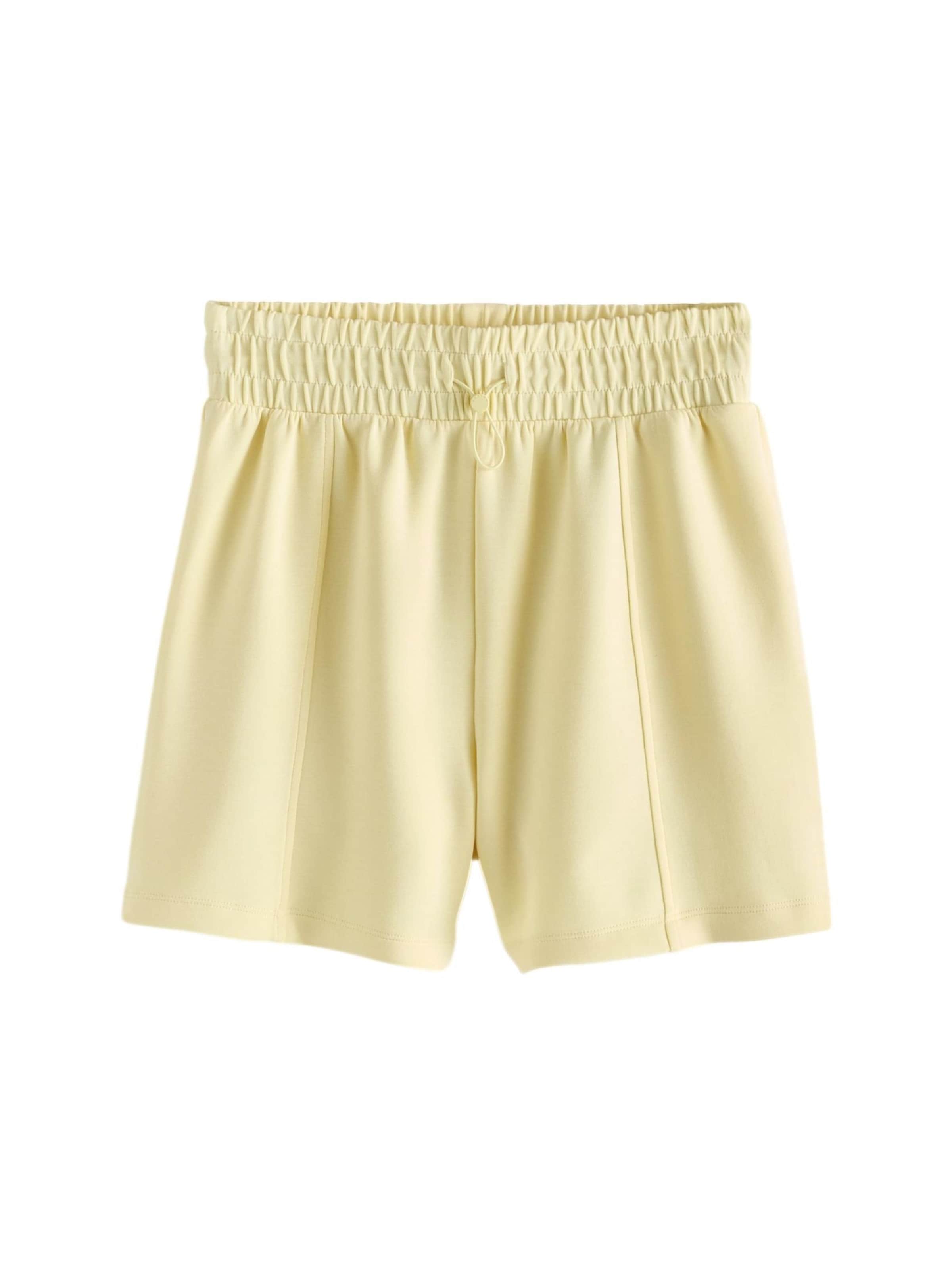 Next Normalny krój Spodnie w kolorze żółty: przód