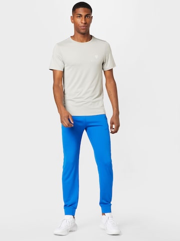 Effilé Pantalon de sport J.Lindeberg en bleu