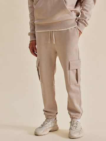 DAN FOX APPAREL Tapered Cargo trousers 'Taylor Heavyweight' in Beige: front