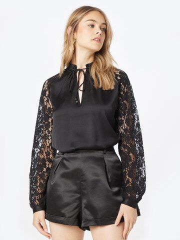 GUESS - Blusa en negro: frente