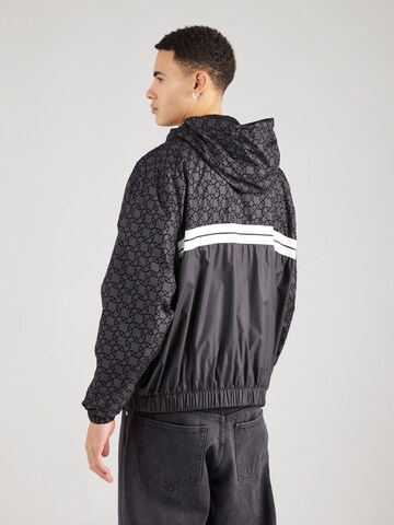 ELLESSE Between-season jacket 'Trezi' in Black