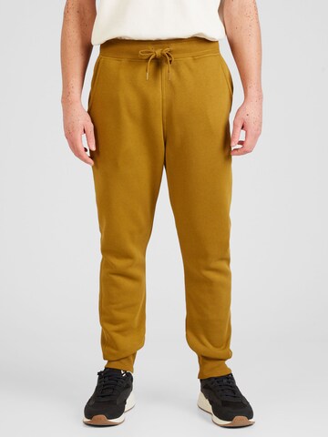 G-Star RAW - Tapered Calças 'Premium core' em castanho: frente