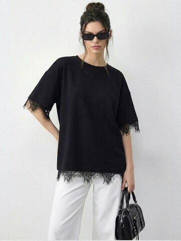 T-shirt 'T-Shirts' Bianco Lucci en noir : devant