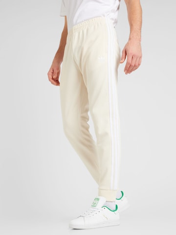 ADIDAS ORIGINALS Tapered Pants 'Adicolor Classics SST' in White: front