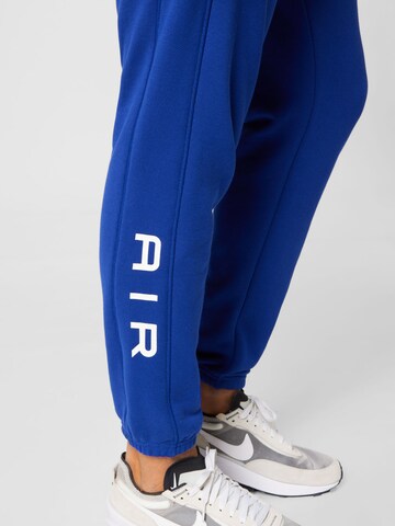 Nike Sportswear Tapered Trousers in Blue