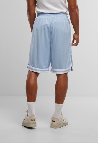 Regular Pantalon 'Small Signature' Karl Kani en bleu