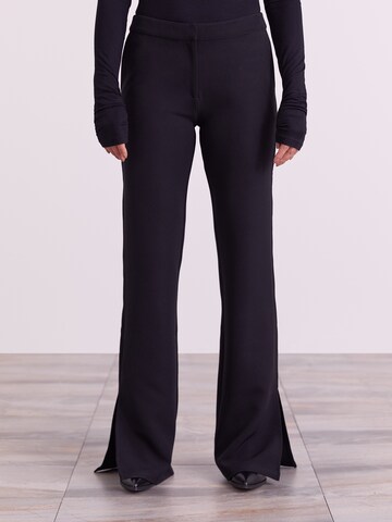 ABOUT YOU x Iconic by Tatiana Kucharova Flared Pants 'Edina' in Black: front