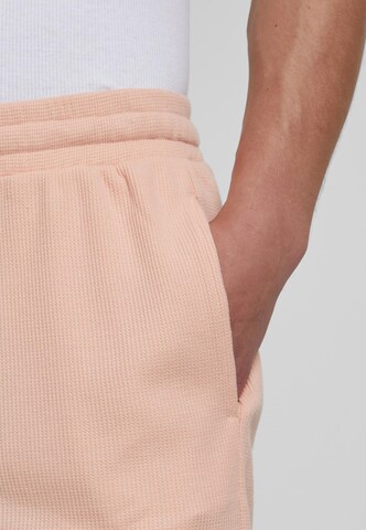 Urban Classics Loose fit Trousers in Orange