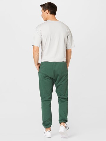 Kosta Williams x About You Regular Trousers in Green