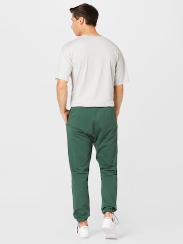 Kosta Williams x About You Regular Pants in Green