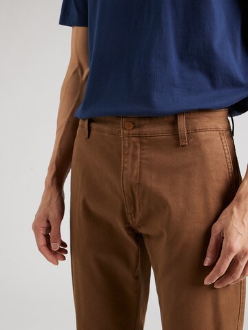 LEVI'S ® Zwężany krój Chinosy w kolorze brązowy