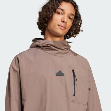 ADIDAS SPORTSWEAR Μπουφάν πεζοπορίας 'City Escape' σε καφέ