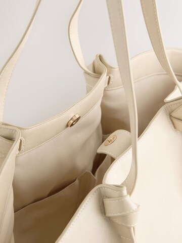 Sac bandoulière Next en beige