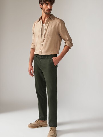 Slimfit Pantaloni chino di Next in verde