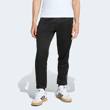ADIDAS ORIGINALS Tapered Pants in Black: front