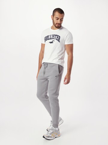 HOLLISTER - Tapered Calças em cinzento