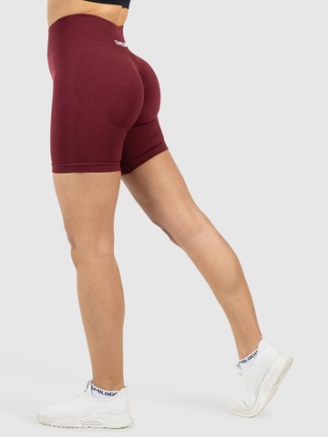 Coupe slim Pantalon de sport ' Nomeli ' Smilodox en rouge