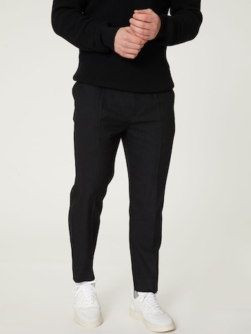 DAN FOX APPAREL Tapered Pleated Pants 'Ediz' in Black: front