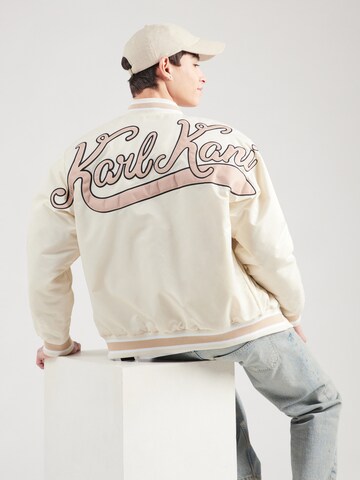 Veste mi-saison 'Diner' Karl Kani en beige : devant