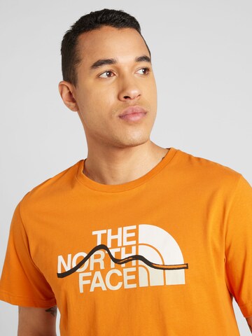 THE NORTH FACE Μπλουζάκι 'MOUNTAIN LINE' σε πορτοκαλί