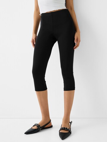 Bershka Skinny Leggings in Black: front