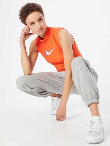 Top di Nike Sportswear in arancione