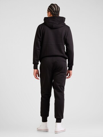 Tuta da jogging di TOMMY HILFIGER in nero