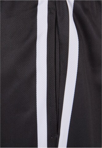 Karl Kani Regular Trousers in Black