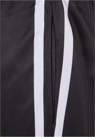 Karl Kani Regular Trousers in Black