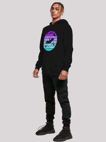 Sweat-shirt 'Retro Alien Weltraum Sonnenuntergang' F4NT4STIC en noir