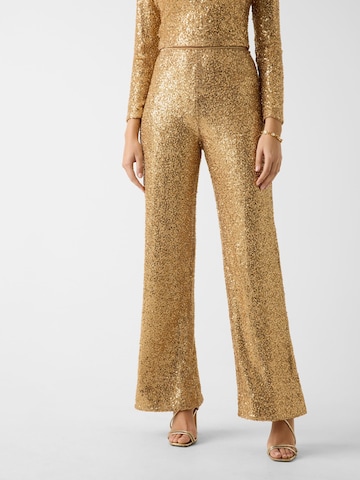 GUESS Flared Pants in Gold: front