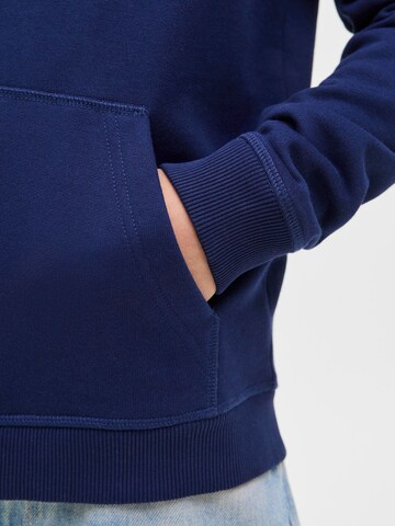 Veste de survêtement Jack & Jones Junior en bleu