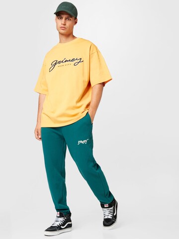 Grimey - Tapered Pantalón 'THE WESTBOUND' en verde